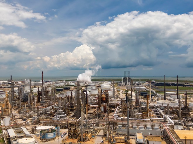 An oil refinery sprawls along the Texas Gulf Coast. - Shutterstock / Grindstone Media Group