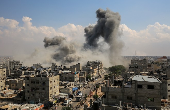 Smoke rises from an Israeli airstrike in Gaza in October, 2023. - Anas-Mohammed