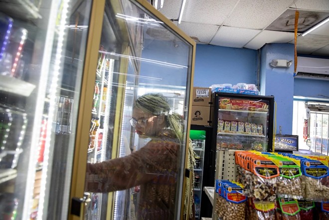 Morningstar stops at a convenience store to buy food before taking the bus. “I wasn't given any help when I aged out. I wasn't given any phone number to help me at all,” Morningstar said. - Texas Tribune / Greta Díaz González Vázquez