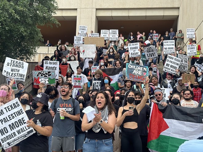 Community organizer Moureen Kaki, center, leads protesters in pro-Palestinian chants. - Michael Karlis