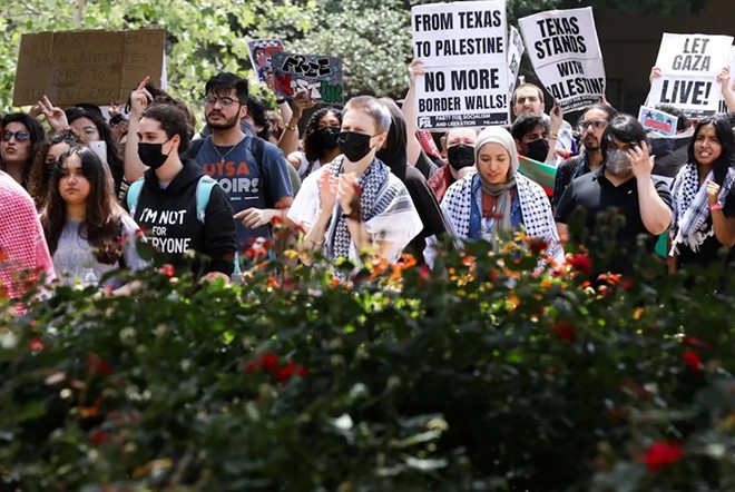 Pro-Palestinian protesters calling for a ceasefire in Gaza march through the outdoor corridors of UTSA on Wednesday, April 24, 2024. - Courtesy Photo / Scott Ball of San Antonio Report