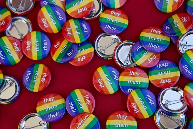 Free pronoun buttons at the AISD "Pride Out!" Party in the Park event at Eastside Early College High School in Austin on Saturday, Mar. 26, 2022. There were fill-in-the-blank and other options not pictured as well. - Texas Tribune / Lauren Witte