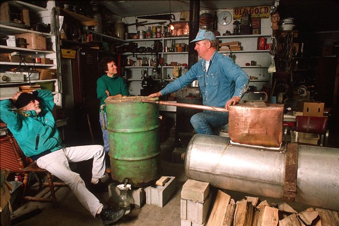 A former moonshiner explains how a homemade still works. - Courtesy Photo / American Folklife Center, Prints and Photographs Division, Library of Congress, Washington, D. C.