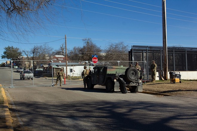 National Guard members stand at the gated entrance to Shelby Park in February. Reporters were allowed to cover a press conference convened by Gov. Greg Abbott. - Francesca D'Annunzio