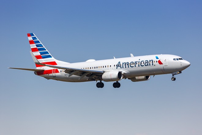 An American Airlines Boeing 737-800 jet takes flight. - Shutterstock / Markus Mainka