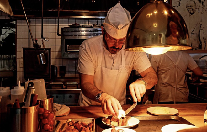 Christopher Cullum of Cullum's Attaboy assembles a plate in his restaurant's kitchen. San Antonio tourism officials hope the city's inclusion in the forthcoming Michelin Guide Texas will further elevate the profile of its food scene. - Instagram / cullumsattaboy