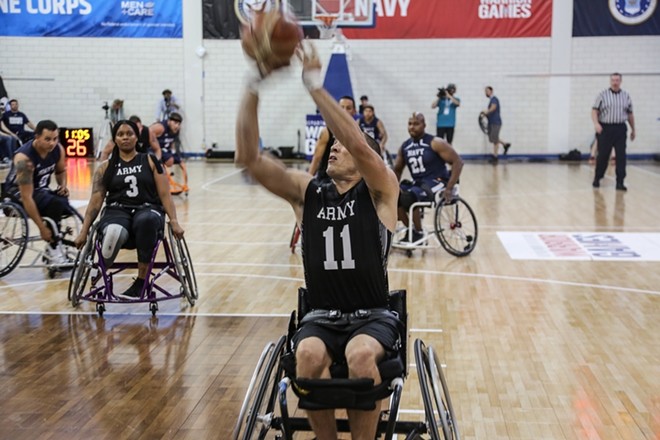 U.S. Army Staff Sgt. Shawn Runnells, Team Army athletes, competes in wheelchair basketball during the 2018 Warrior Games in Colorado Springs, Colorado. - Public Domain / Pfc. Julie Driver