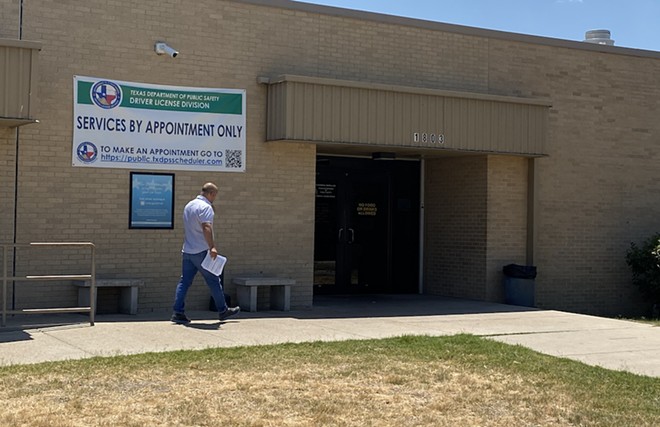 An individual walks into a DPS drivers license office in South San Antonio. - Sanford Nowlin