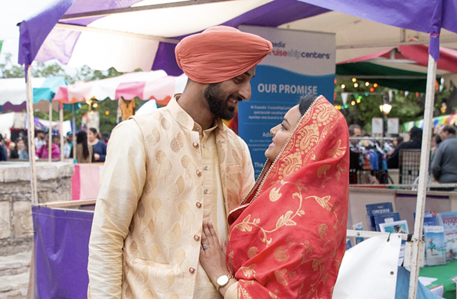 Revelers pause for a romantic moment at 2019's Festival of India. - Drew Patterson / Neptune9 Photography