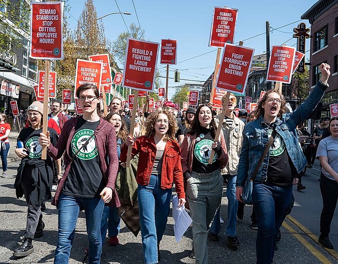 Starbucks workers march as part of their effort to secure union representation. - Wikimedia Commons / Elliot Stoller