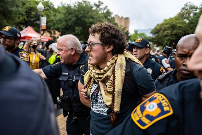 University of Texas at Austin police arrest student Ammer Qaddumi during a pro-Palestinian demonstration on April 24. He is suing the university, claiming it violated his First Amendment rights. - Texas Tribune / Julius Shieh