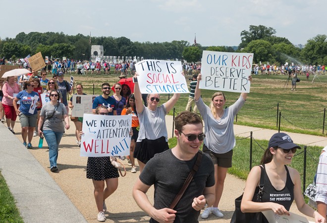 Teachers attend a protest march against the expansion of school vouchers. - Shutterstock / Bob Korn