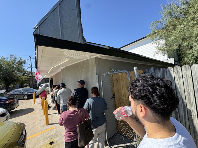 The line grew long Wednesday as customers waited for Three Amigos to reopen. - Stephanie Koithan