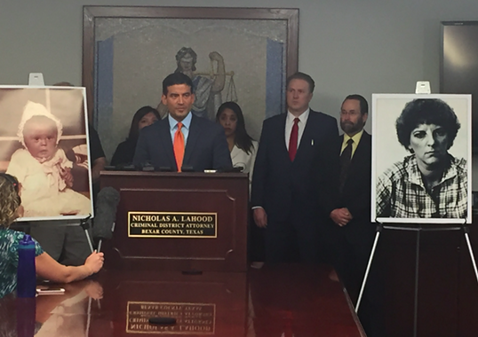 Distract Attorney Nico LaHood addresses reporters on Wednesday, with a dated photo of Genene Jones and Rosemary Vega behind him. - ALEX ZIELINSKI