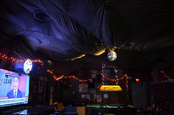 A parachute hangs above the disco ball at Betty's