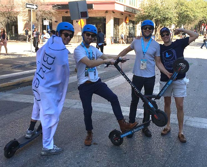 SXSW attendees try out San Antonio startup company Blue Duck Scooters' rentable rides. - COURTESY OF BLUE DUCK SCOOTERS