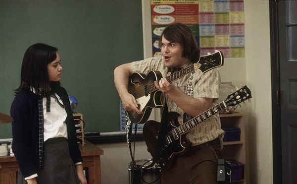 "Mr. S" (Jack Black) shows Katie (Rivkah Reyes) how to play bass guitar.