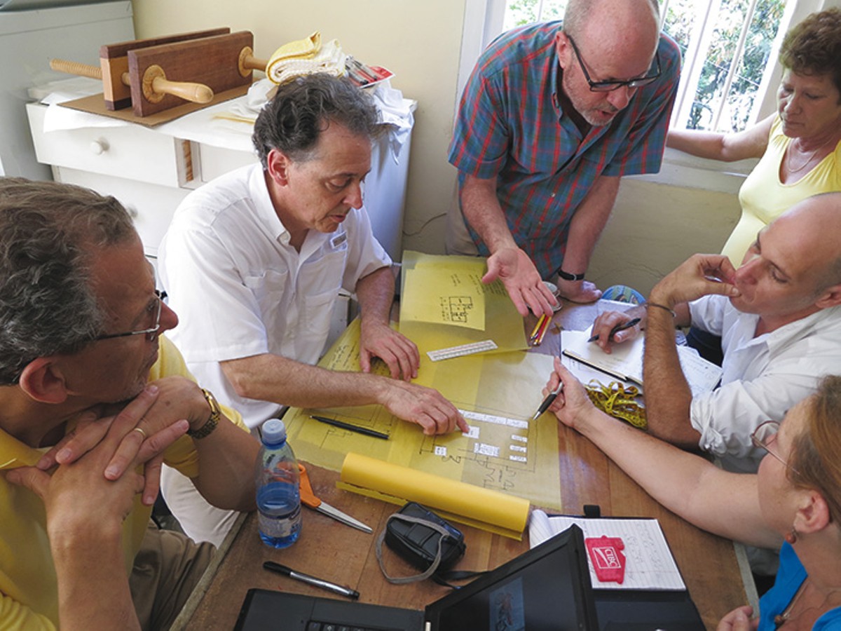 Cuban and American colleagues work on the design for a new archival facility in Hemingway’s basement in 2012.
