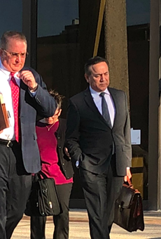 Uresti (right) leaves the federal courthouse with his legal team during his February 2018 trial.