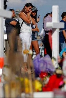 Mourners gather at a memorial for victims of the El Paso Walmart shooting.