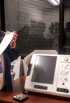 Bexar Elections Administrator Jacque Callanen displays a paper ballot produced by the county's new voting machines.