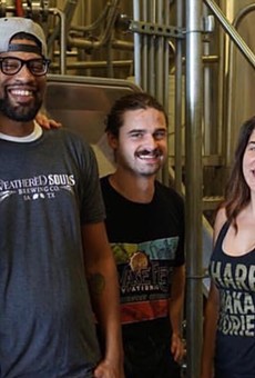 Weathered Souls founder Marcus Baskerville (second from left) visits a Miami craft brewery in 2018 — the site of another of his collaborations.