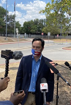 U.S. Rep. Joaquin Castro speaks to reporters outside San Antonio's main post office distribution site.