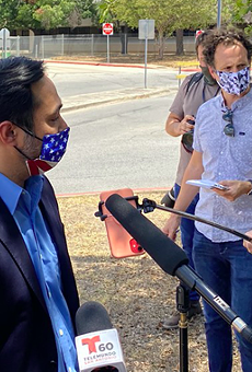 U.S. Rep. Joaquin Castro speaks to reporters outside San Antonio's central mail distribution site.