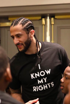 Colin Kaepernick meets with young people at one of his Know Your Rights camps.