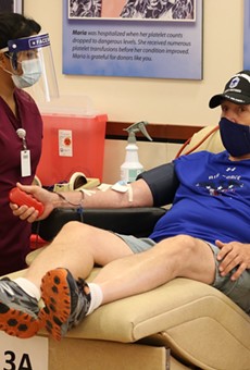 A donor gives blood at a South Texas Blood and Tissue Center site.