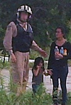 This 2014 photo shows a dehydrated teenage girl accompanied by a little girl who Border Patrol rescued in the Rio Grande Valley.