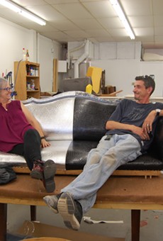 This photo is a little more than a week old. It shows Fiona Arecchi, left, and Lee Williams, right, sitting on a work in progress: the Fiesta Cornyation throne.