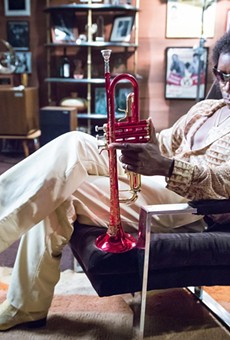 Don Cheadle as jazz trumpeter Miles Davis.