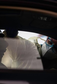 A nurse conducts a swab test for COVID-19 on a patient in a drive-thru station at the Austin Emergency Center at Mueller on Jan. 25, 2021. Since the fall, the CDC says there have been several new variants identified worldwide: A UK variant (B.1.1.7), a South African variant (B1.351) and a Brazilian variant (P.1).