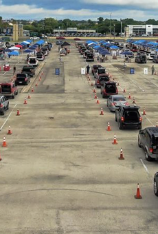 Cars line up for an emergency food distribution in San Antonio.