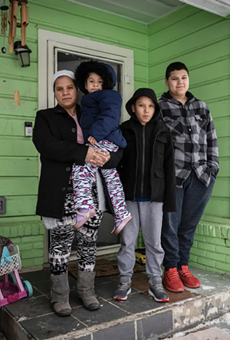 Marleny Almendarez, 38, with her niece Madelyne Hernandez, 3, and two boys, Aaron Hall, 11, and Matthew Hall, 14, outside their home in Dallas on Feb. 18, 2021. The family spent two nights at a mobile warming station to avoid the cold temperatures.
