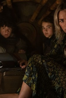 Evelyn (Emily Blunt, far right) and her children, from left, Marcus and Regan, hide inside a furnace to avoid alien attackers in "A Quiet Place Part II"