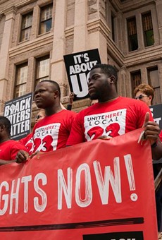Individuals stand on the south steps of the Texas Capitol in support of voting rights at a press conference organized by Black Voters Matter, the Texas Right to Vote Coalition, Texas for All Coalition and other advocacy groups on July 8, 2021.