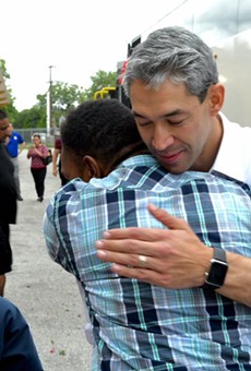 Mayor Ron Nirenberg hugs a Hurricane Harvey evacuee on Saturday.