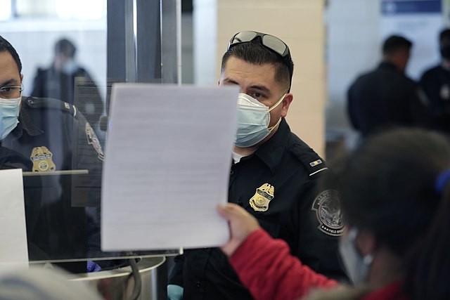 Border Patrol officers process asylum seekers at a Texas station earlier this year. - U.S. CUSTOMS AND BORDER PROTECTION