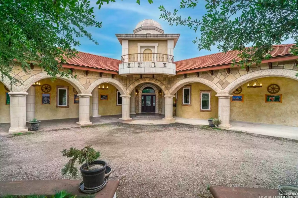 This San Antonio home for sale comes with a master-bedroom hot tub with a fireplace right next to it