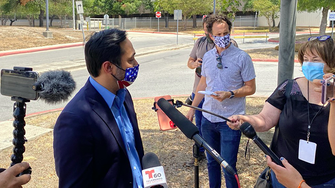 U.S. Rep. Joaquin Castro speaks to reporters outside San Antonio's central mail distribution site.