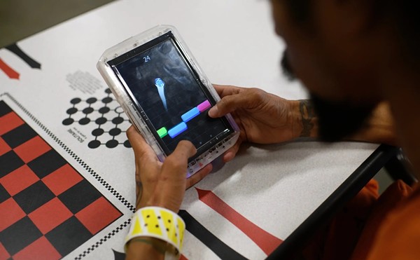 A man plays a game in the Brothers in Arms cell block, a new veteran-focused program, at the Harris County Joint Processing Center, part of the county jail system, on Tuesday, April 16, 2024, in Houston.