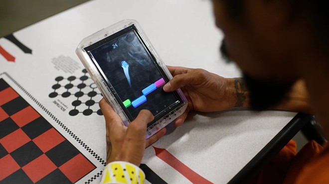 A man plays a game in the Brothers in Arms cell block, a new veteran-focused program, at the Harris County Joint Processing Center, part of the county jail system, on Tuesday, April 16, 2024, in Houston.
