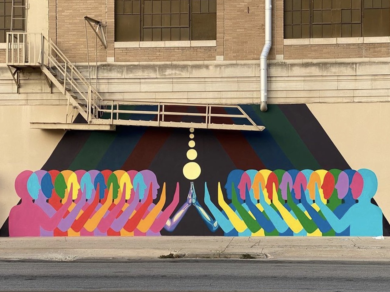 Touch
Herweck's Art Supply, 300 Broadway
Artist: Suzy González
You can draw inspiration from Suzy González's vibrant mural Touch then get supplies at Herweck's to make art of your own.