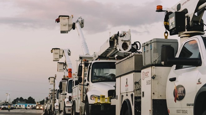 Electric trucks line up to provide support with major power outages after Hurricane Beryl in Houston on July 10, 2024.