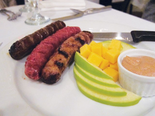 Wild game sampler (buffalo, venison, and wild boar sausages) served with spicy whole-grain mustard at Little Gretel. - HEATHER HERNANDEZ