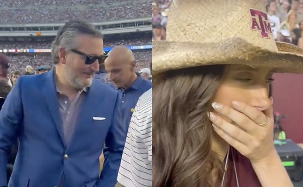 College football fan Lucy Rohden (right) pretends to be nauseated as U.S. Sen. Ted Cruz approaches her on the Texas A&M sidelines.